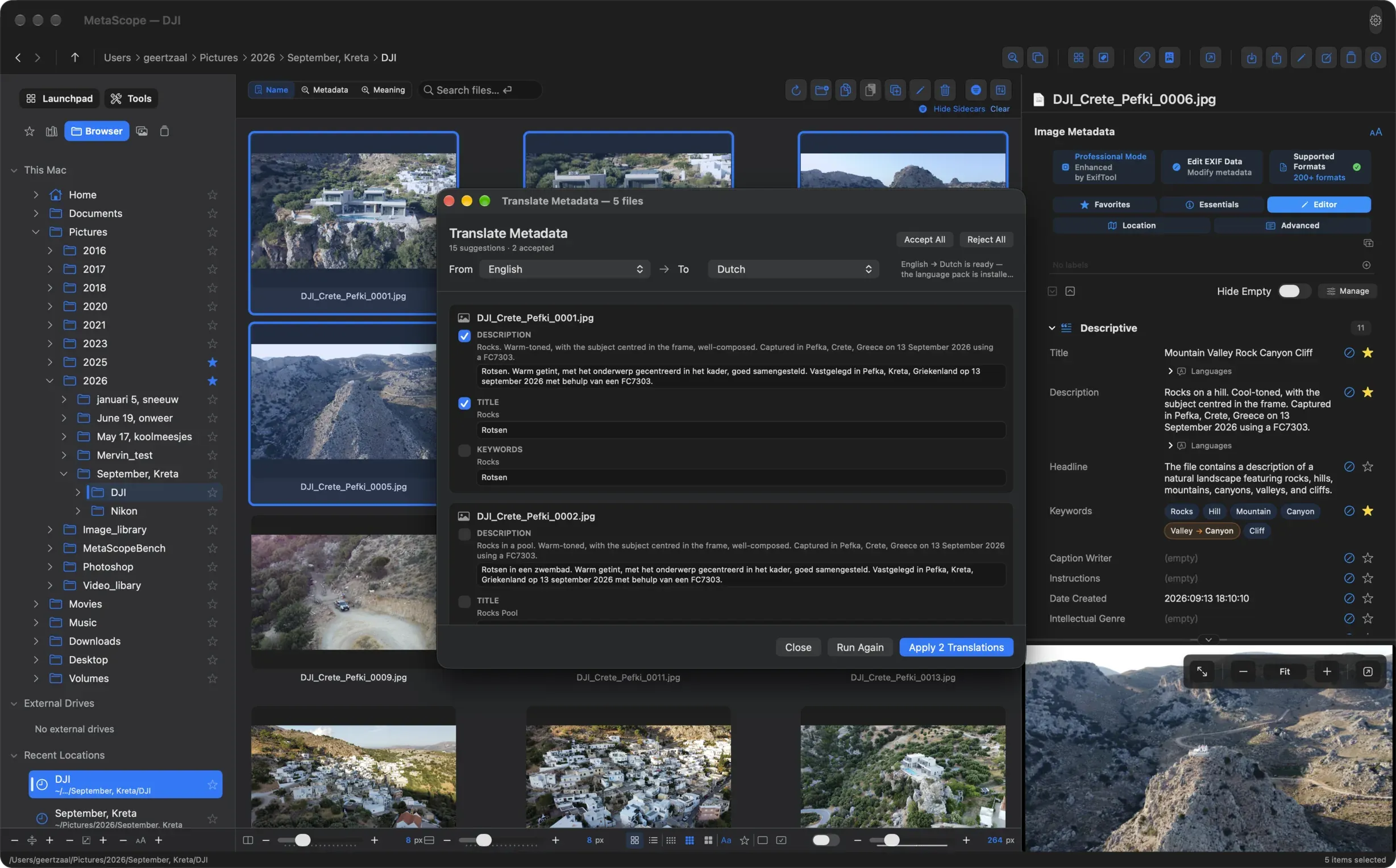 MetaScope 1.6 Translate Metadata review from English to Dutch: each original description, title and keyword sits above its proposed translation with a checkbox, two are ticked, and nothing is written until Apply 2 Translations is pressed.